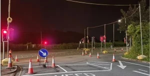 Road closure with signs and corns
